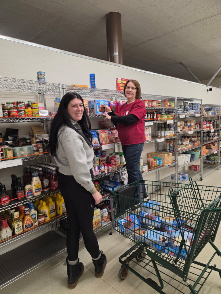 Volunteers stocking shelves
